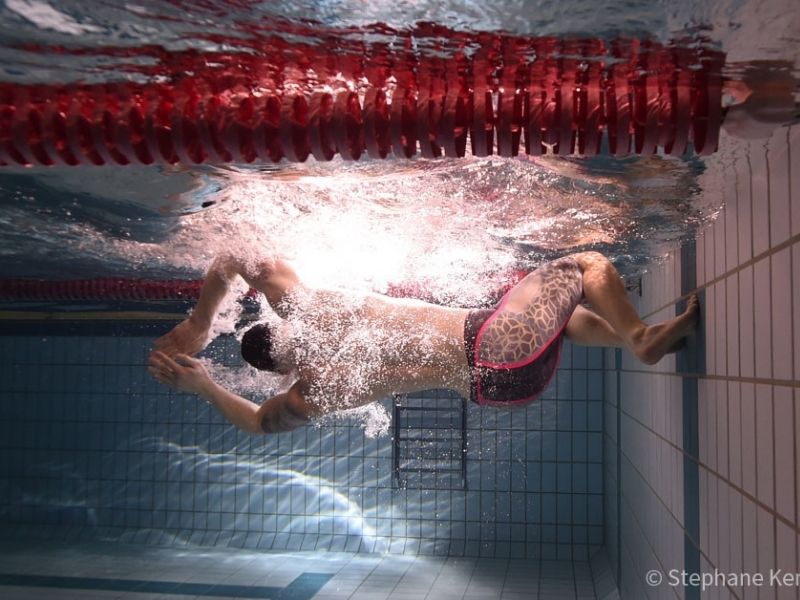 Starting block drills: A swimmer makes a turn underwater