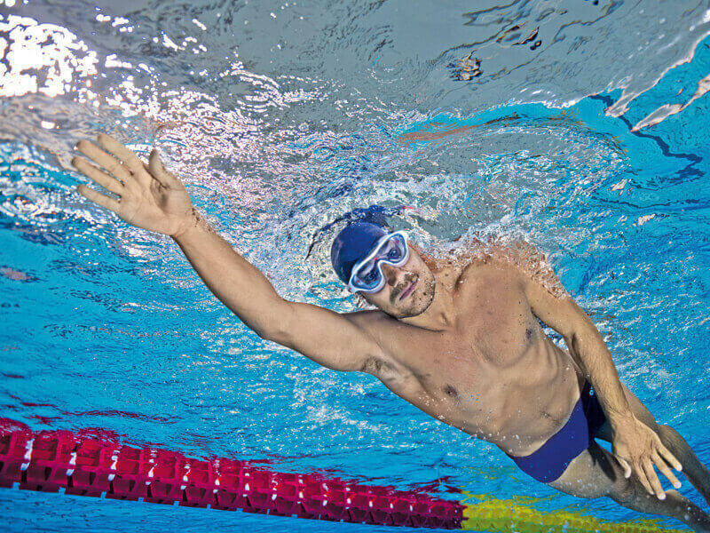 Underwater shot of a man swimming in a pool