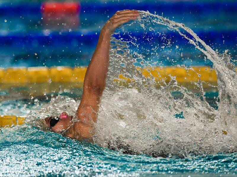 Sideview shot of a swimmer doing backstroke drills