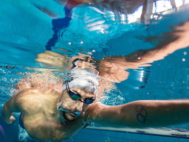 Underwater shot of a person swimming in a pool