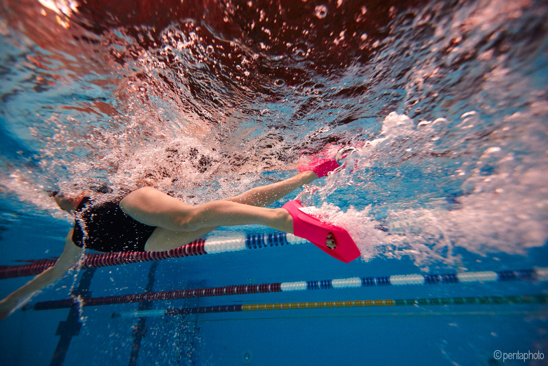 Swimming with fins workout: underwater shot of a swimmer's legs with