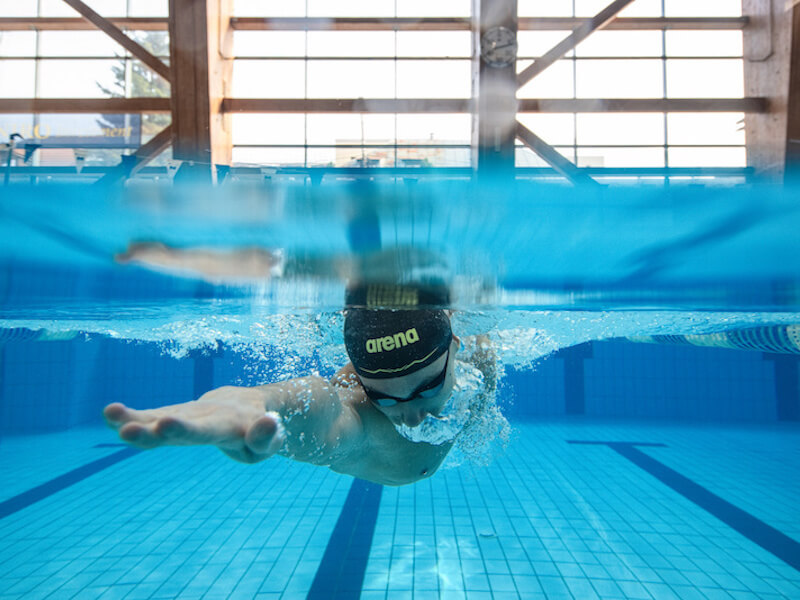 Underwater shot of a swimmer swimming in a pool