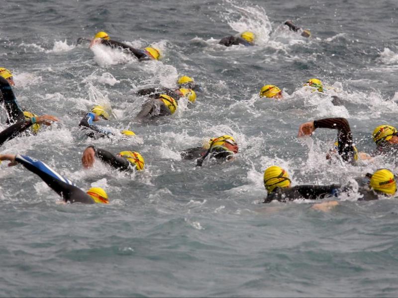 Triathlon goggles: people swimming in the sea