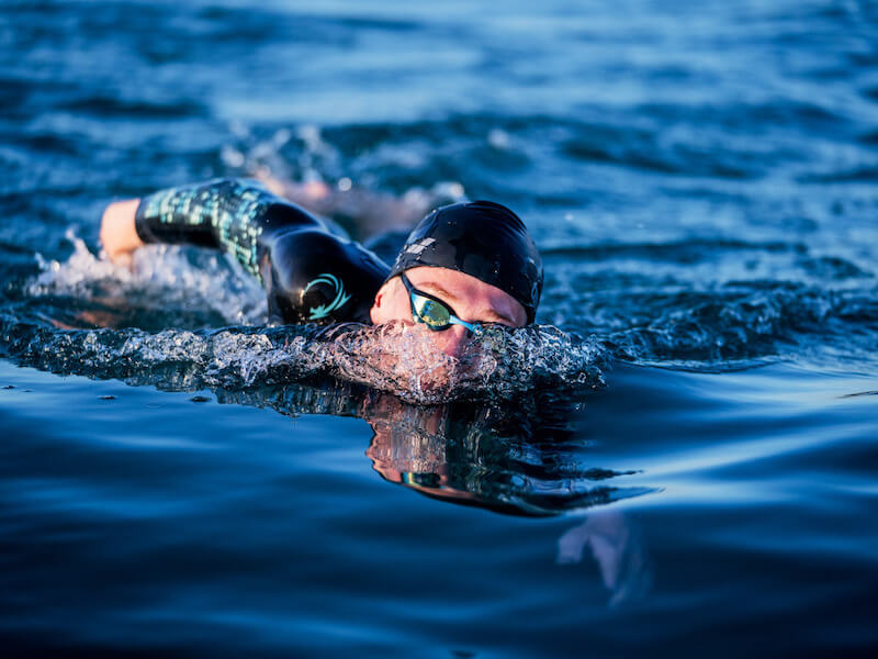 Nose plugs for swimming: An open-water swimmer glides through the water