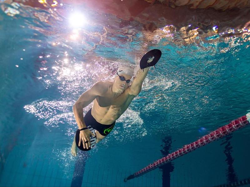 Swimming drills for beginners using paddles