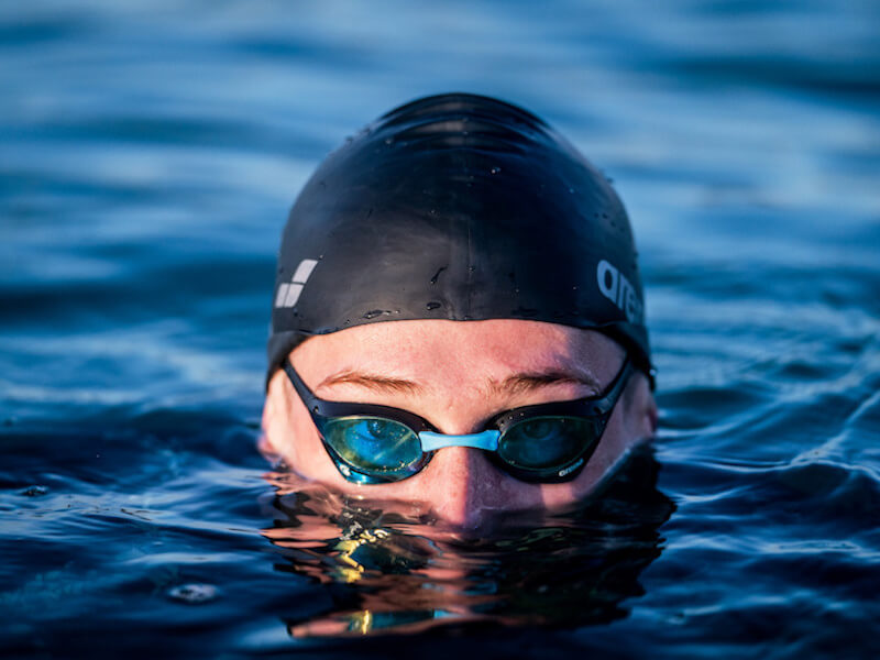 Close-up of a swimmer in the water wearing Open water swimming goggles