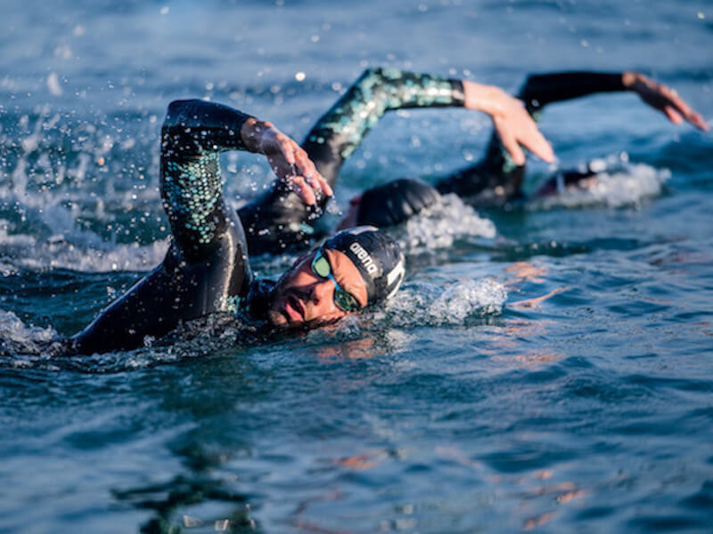 group of swimmers swimming